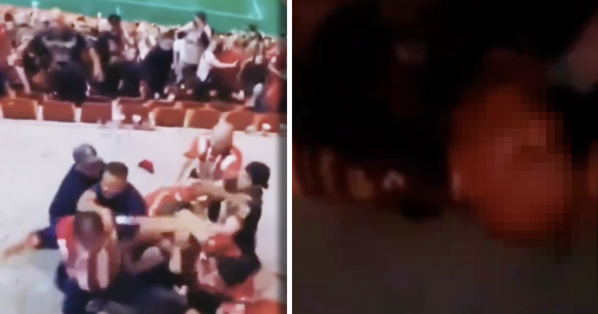 Foto de aficionados peleando y hombre herido